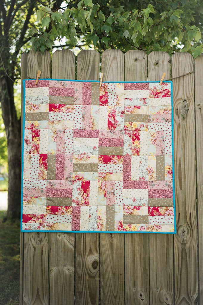 alt="Baby Jelly Roll Quilt Pattern – small lap size quilt perfect for gifts and nurseries"