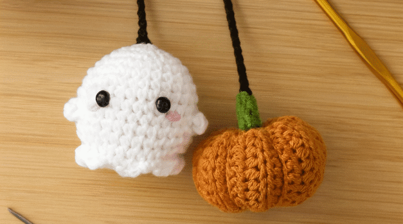 Crochet car charm ghost with pumpkin detail hanging from rearview mirror