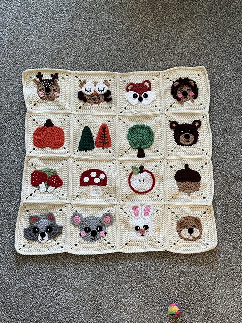Woodland-themed crochet granny square blanket in earthy forest tones