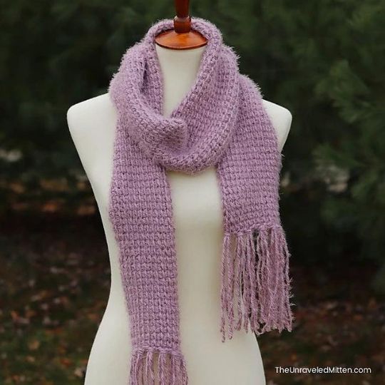 Modern crochet scarf with visible stitch definition and smooth drape