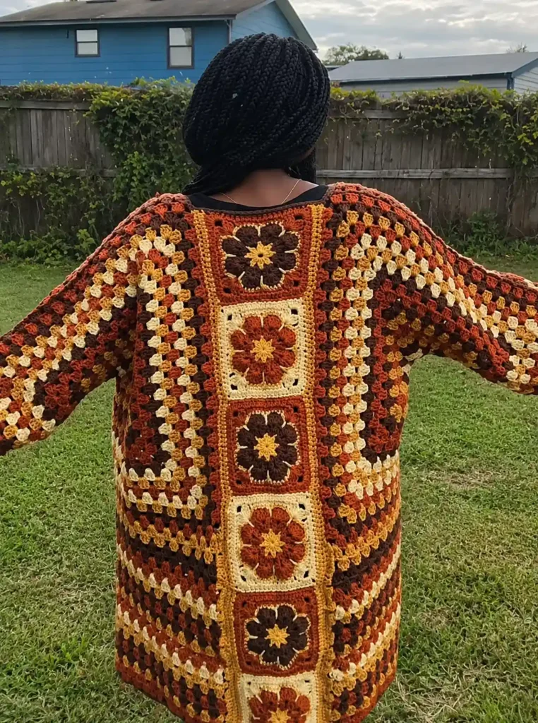 Hexagon cardigan crochet — African Flower Granny Square panel seamed between the two hexagon halves as the back closure