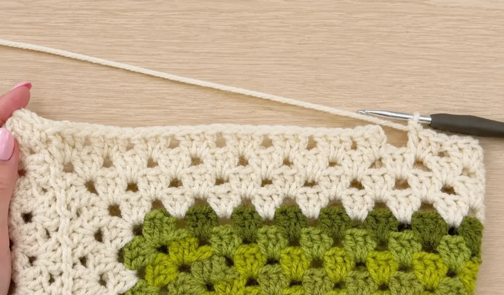 Crochet hexagon cardigan pattern - close up of the BLO border edging in progress