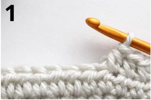 Step-by-step tutorial showing how to half double crochet stitch (hdc) - 1