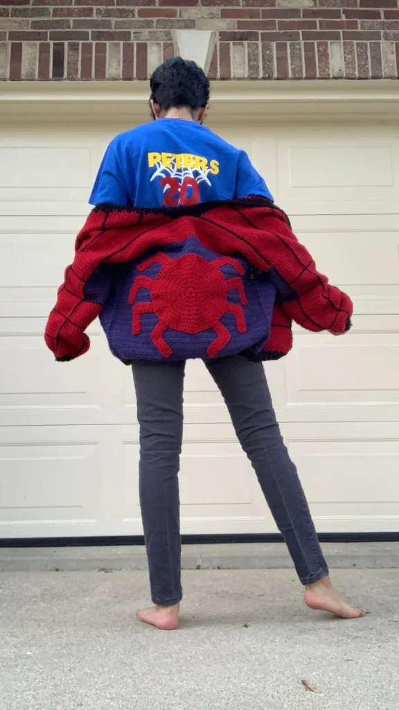Spiderman crochet sweater with red and blue colors and web design