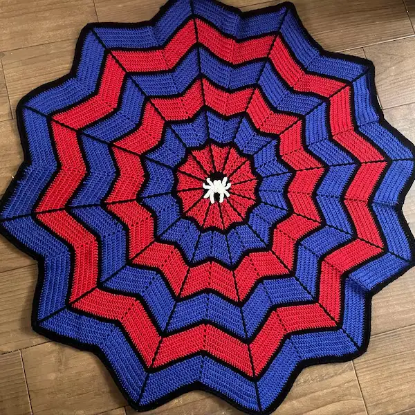 Spider-Man crochet patterns blanket with web pattern in red and black yarn