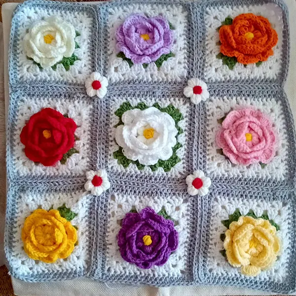 3D rose granny square crochet pattern with layered petals close-up