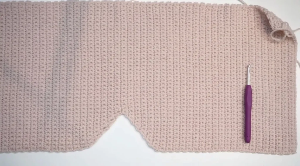 Sophie hood crochet pattern step 4 — slip stitch border being added around the face opening