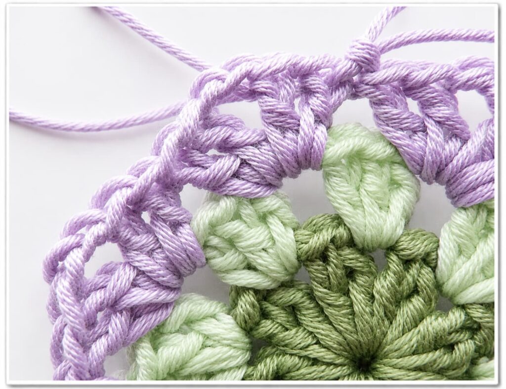 African flower granny square spike single crochet technique close up
