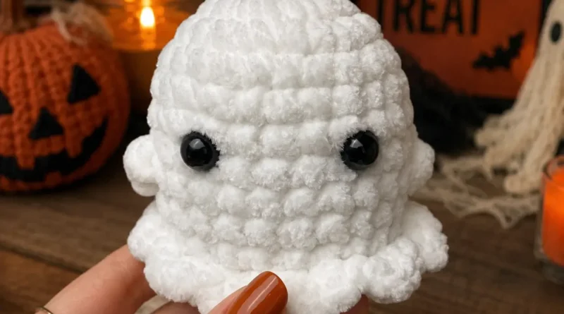 Free crochet ghost pattern — easy beginner amigurumi ghost held in hand with Halloween decorations